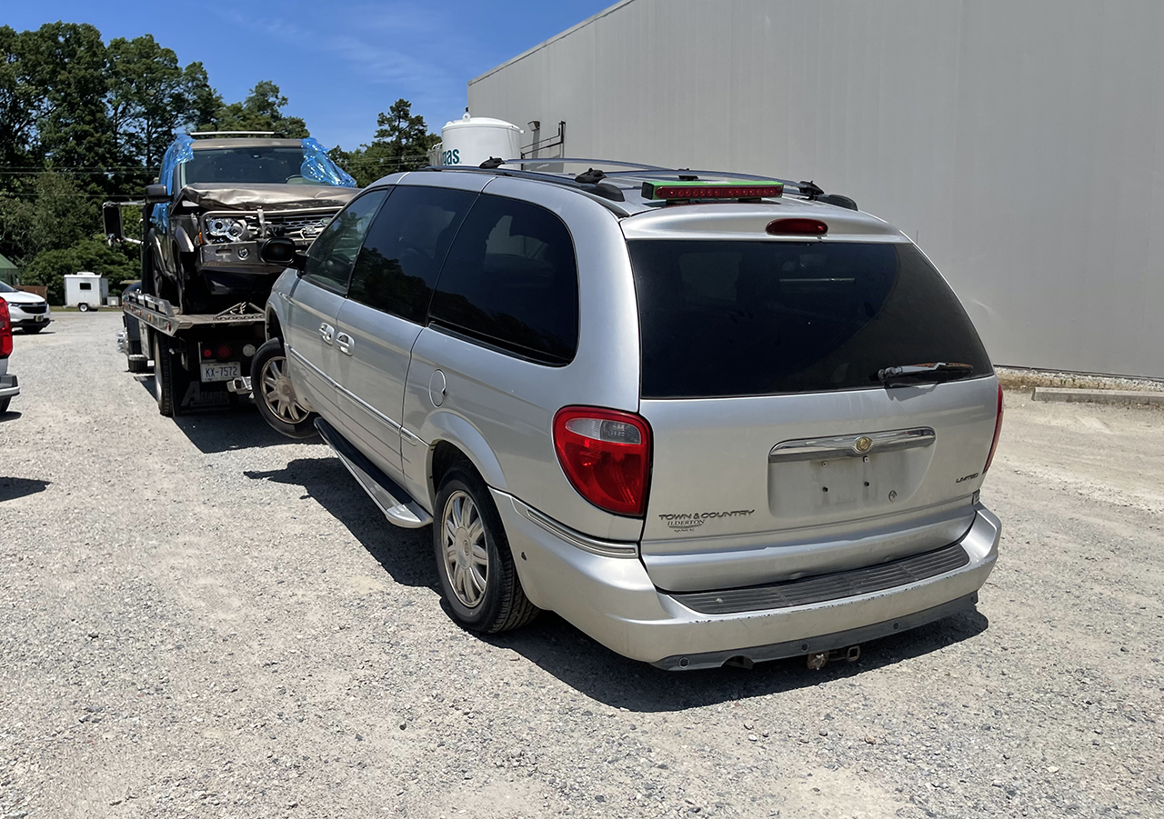 Nordfab's old van hooked to tow truck as van is donated to children's charity